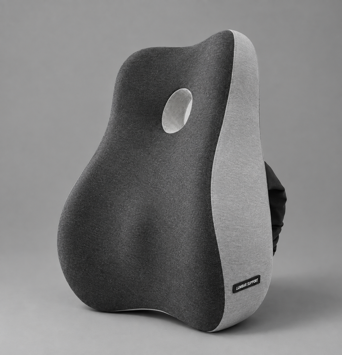 OrthoCore charcoal grey contoured memory foam lumbar support pillow on a plain studio background