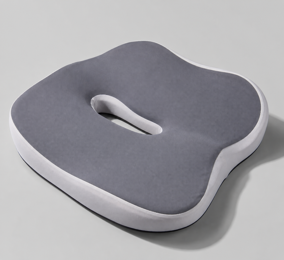 OrthoCore grey contoured memory foam seat cushion on a plain studio background